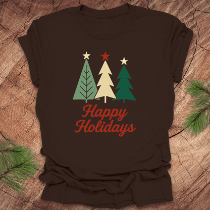 Brown t-shirt with Christmas tree design and 'Happy Holidays' text on a wooden surface.