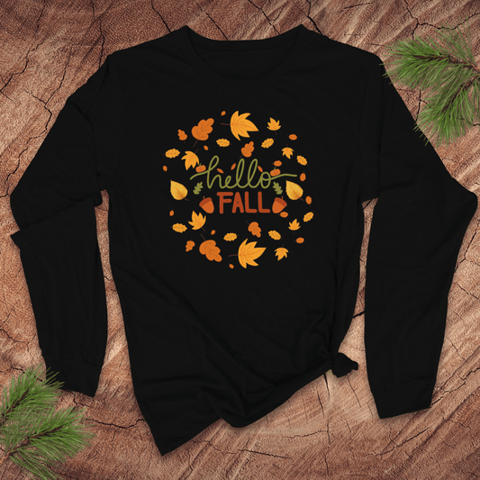 Black long sleeve tshirt with 'hello FALL' and leaf design on a wooden surface