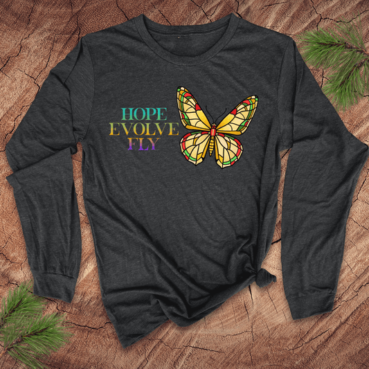 Dark grey long-sleeve shirt with a butterfly design and text on a wooden surface