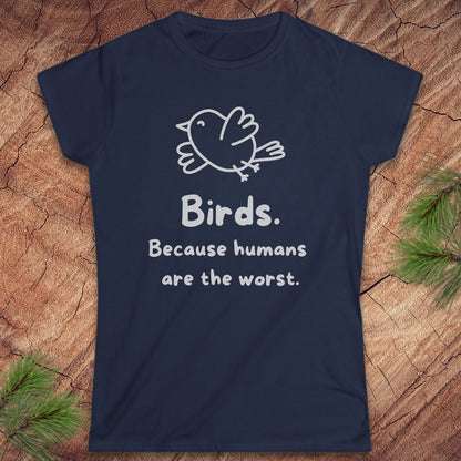 A navy blue short-sleeve t-shirt with a white line-art bird and the text 'Birds. Because humans are the worst.