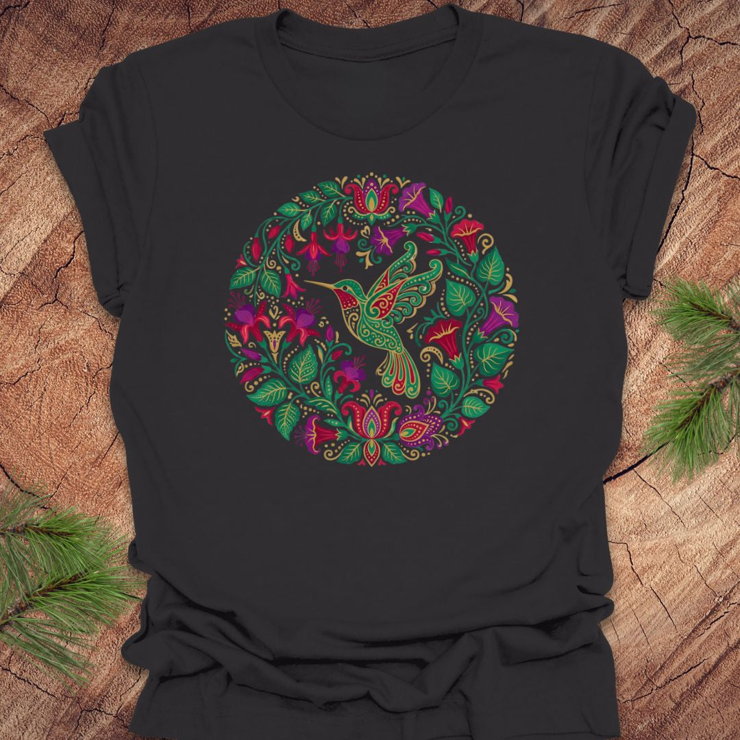 Dark gray t-shirt with a colorful bird and floral design on a wooden surface