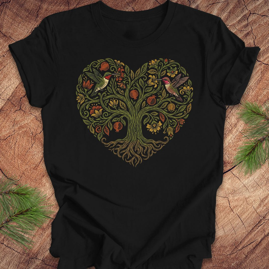 Black t-shirt with a heart-shaped tree design featuring hummingbirds on a wooden surface.
