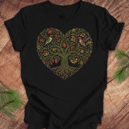 Black t-shirt with a heart-shaped tree design featuring hummingbirds on a wooden surface.