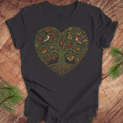 Dark gray t-shirt with a heart-shaped tree design featuring hummingbirds on a wooden surface.