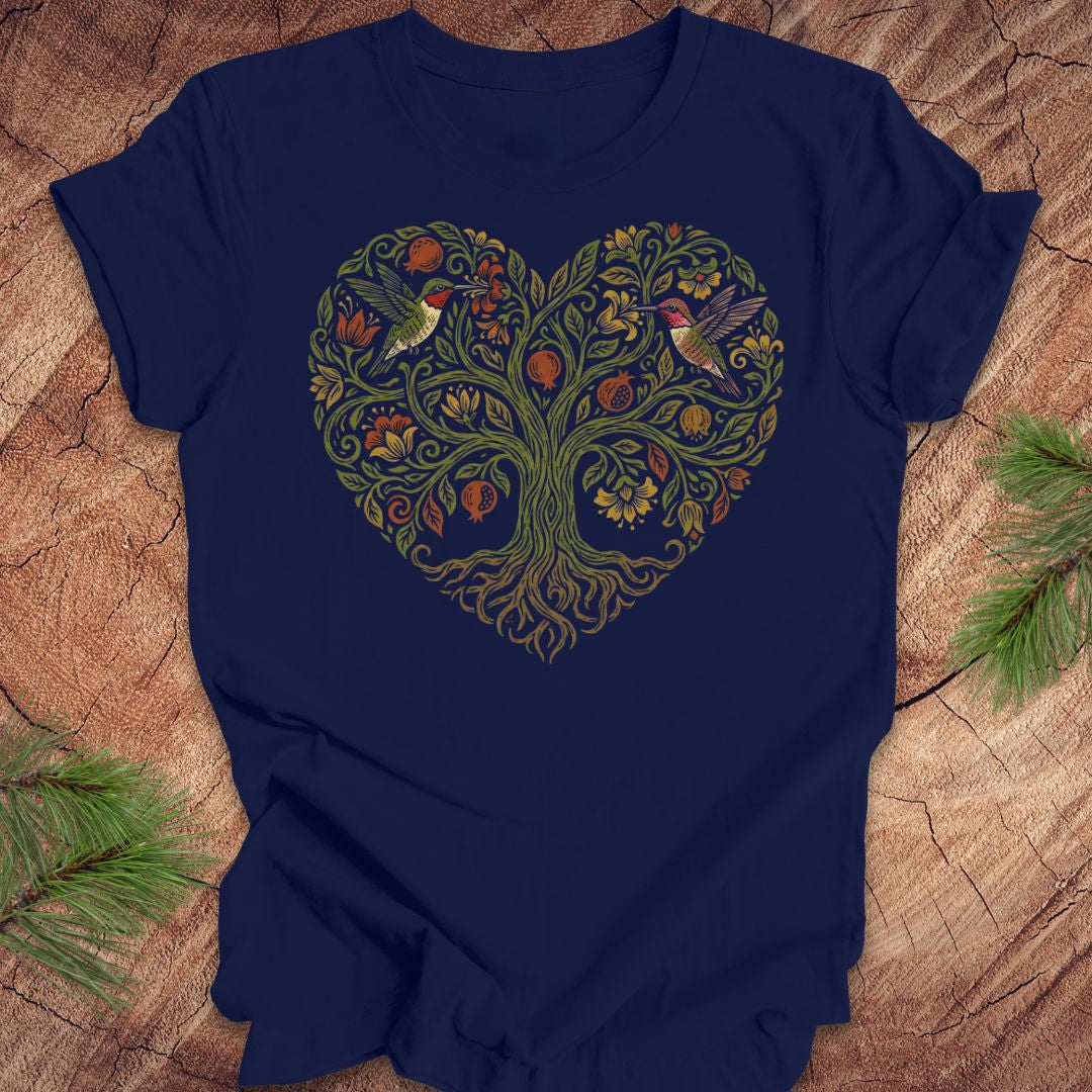 Navy blue t-shirt with a heart-shaped tree design featuring hummingbirds on a wooden surface.