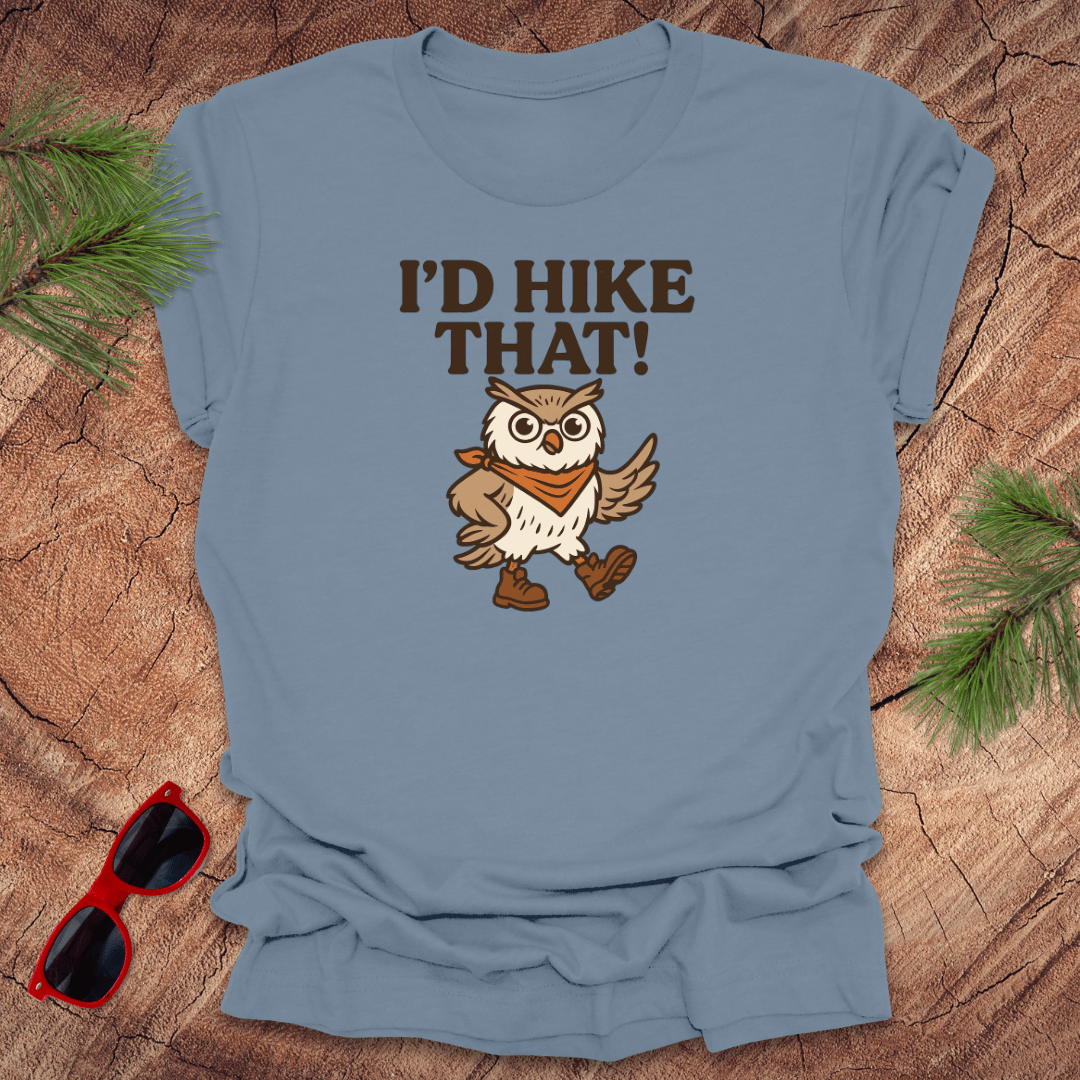 A steel blue t-shirt with a graphic of an owl wearing a hat and the text 'I'D HIKE THAT!' printed above.