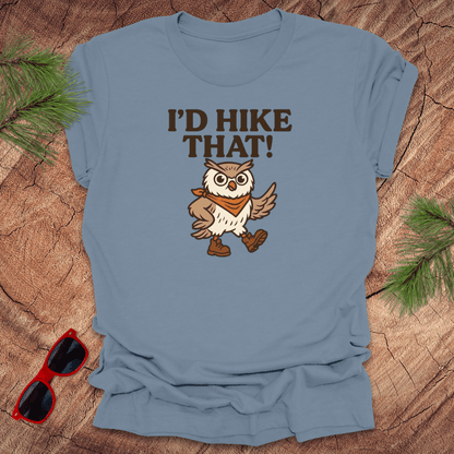 A steel blue t-shirt with a graphic of an owl wearing a hat and the text 'I'D HIKE THAT!' printed above.