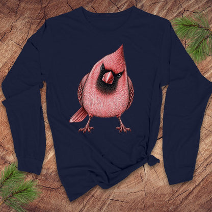 Navy blue long-sleeve shirt with a red cardinal bird design on a wooden surface.