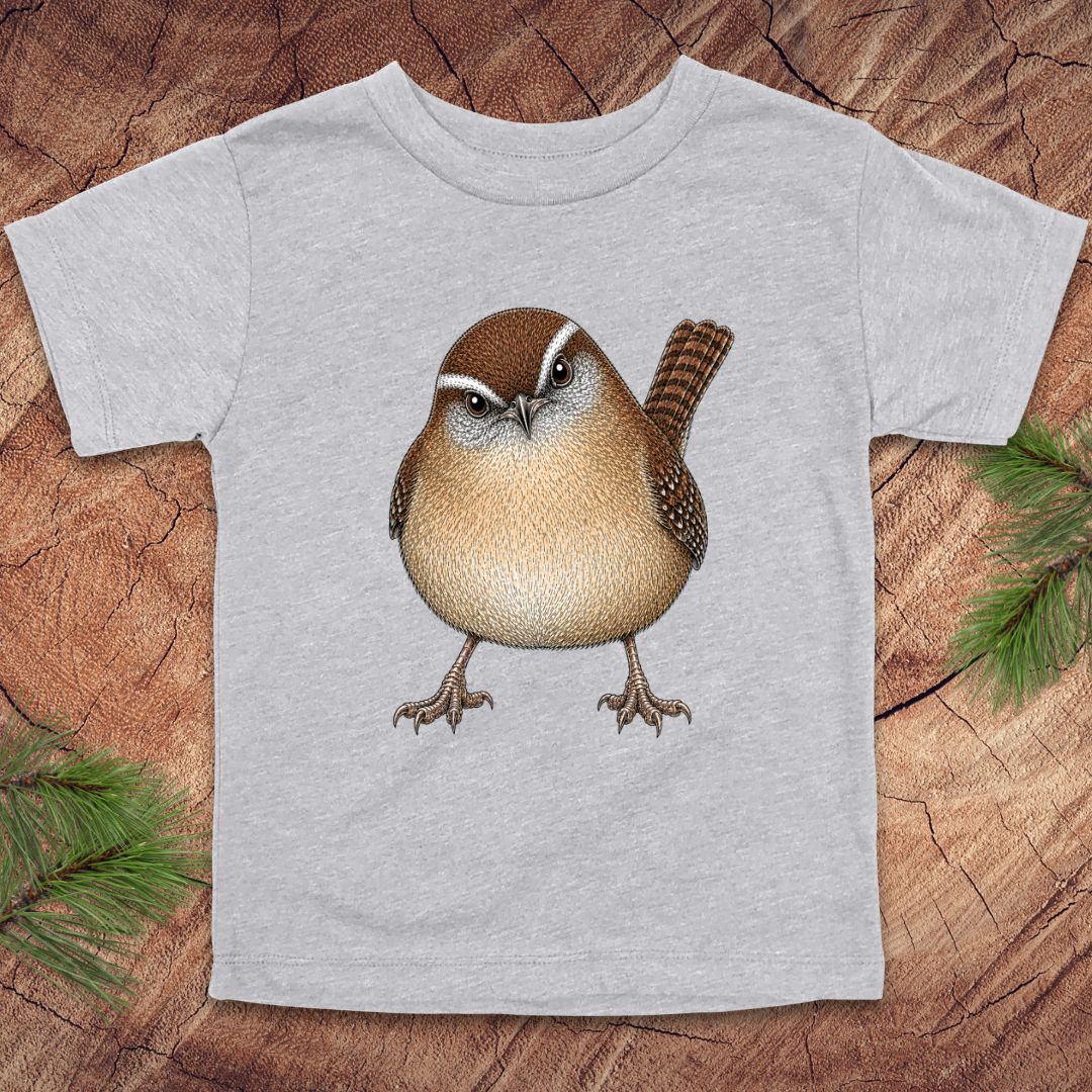 Gray toddler t-shirt with a carolina wren design on a wooden surface
