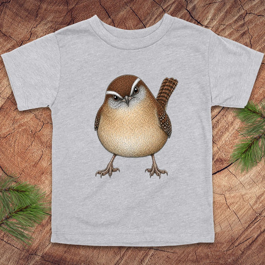 Gray toddler t-shirt with a carolina wren design on a wooden surface
