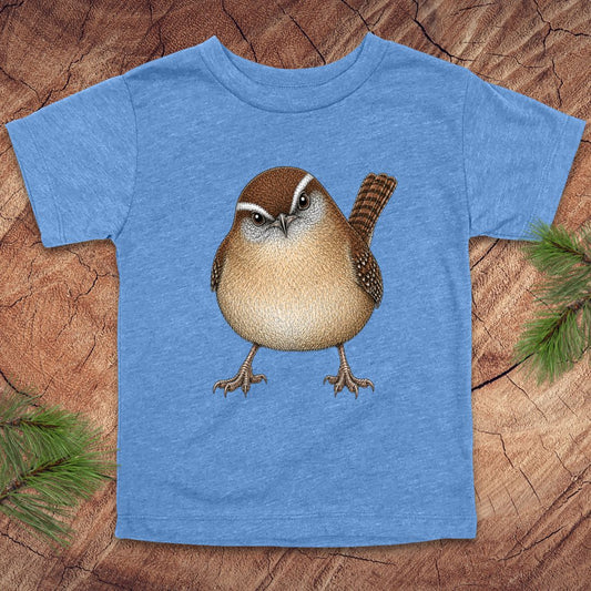 Blue toddler t-shirt with a carolina wren design on a wooden surface