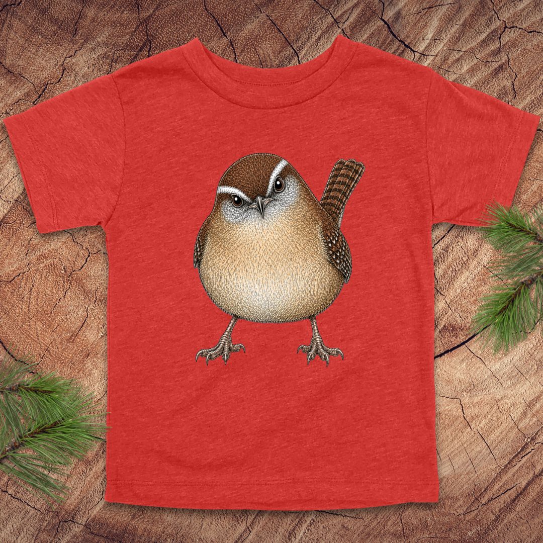 Red toddler t-shirt with a carolina wren design on a wooden surface