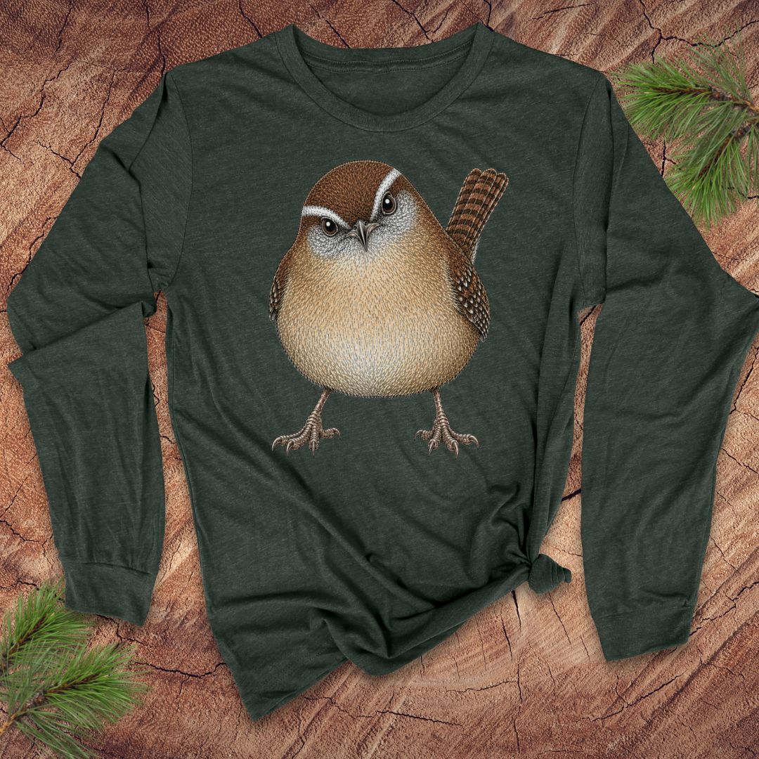 Green long-sleeve t-shirt with a carolina wren design on a wood background.
