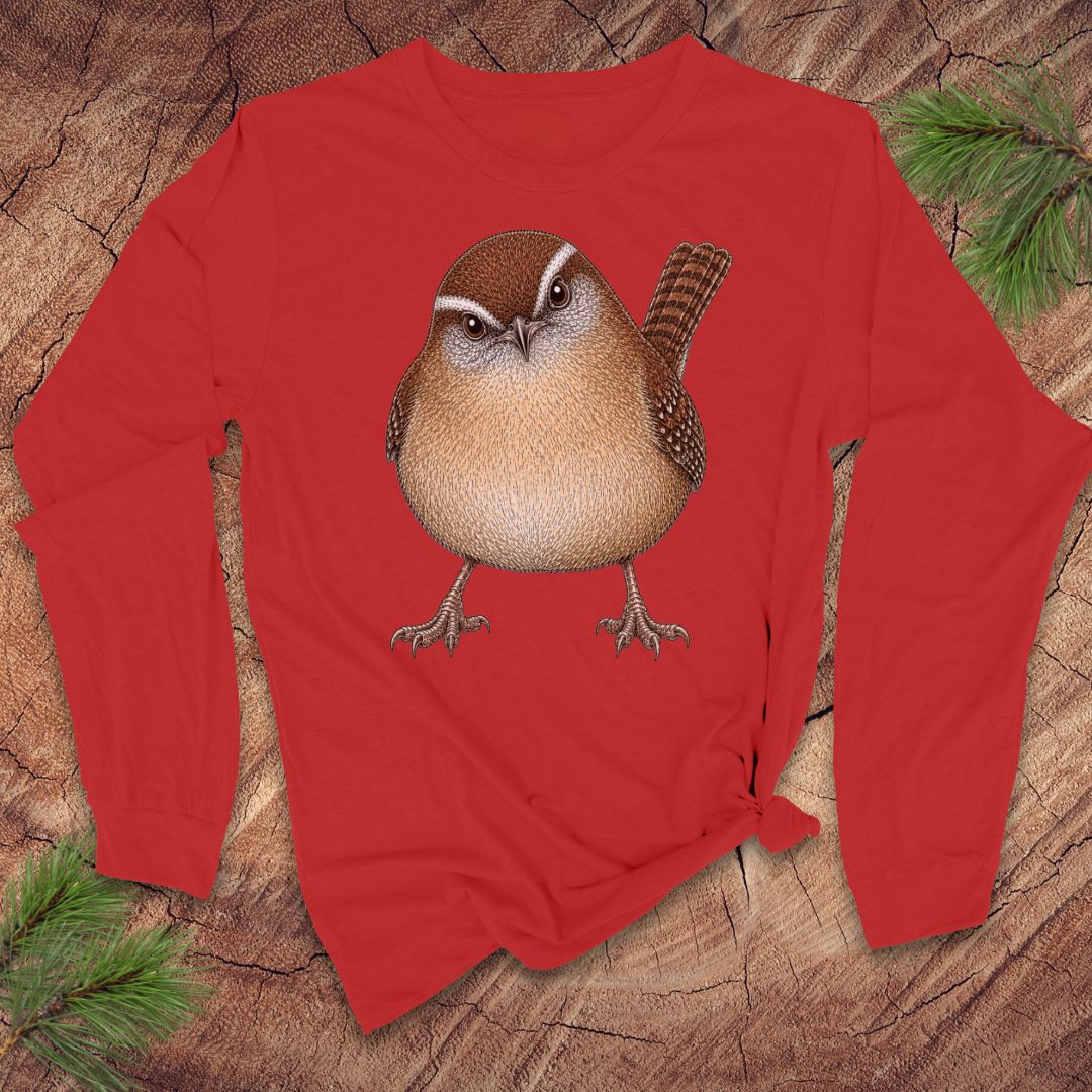 Red long-sleeve t-shirt with a carolina wren design on a wood background.