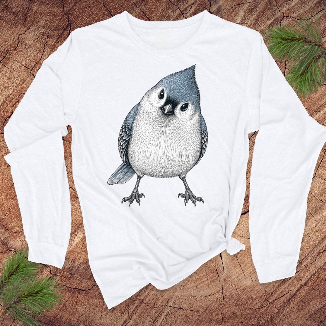 White long-sleeve t-shirt with a titmouse graphic on a wood background.