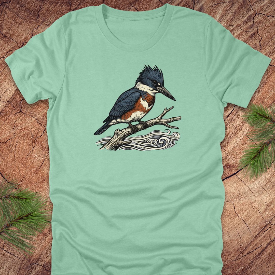 Mint green t-shirt with a kingfisher bird design on a wooden surface