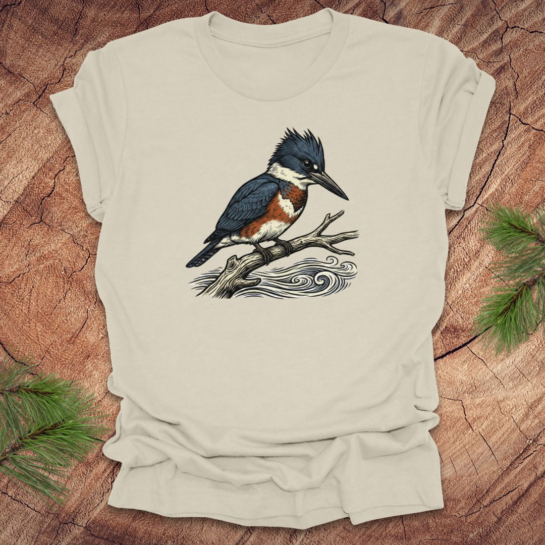 Beige t-shirt with a kingfisher bird design on a wooden surface
