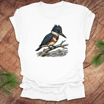 White t-shirt with a kingfisher bird design on a wooden surface