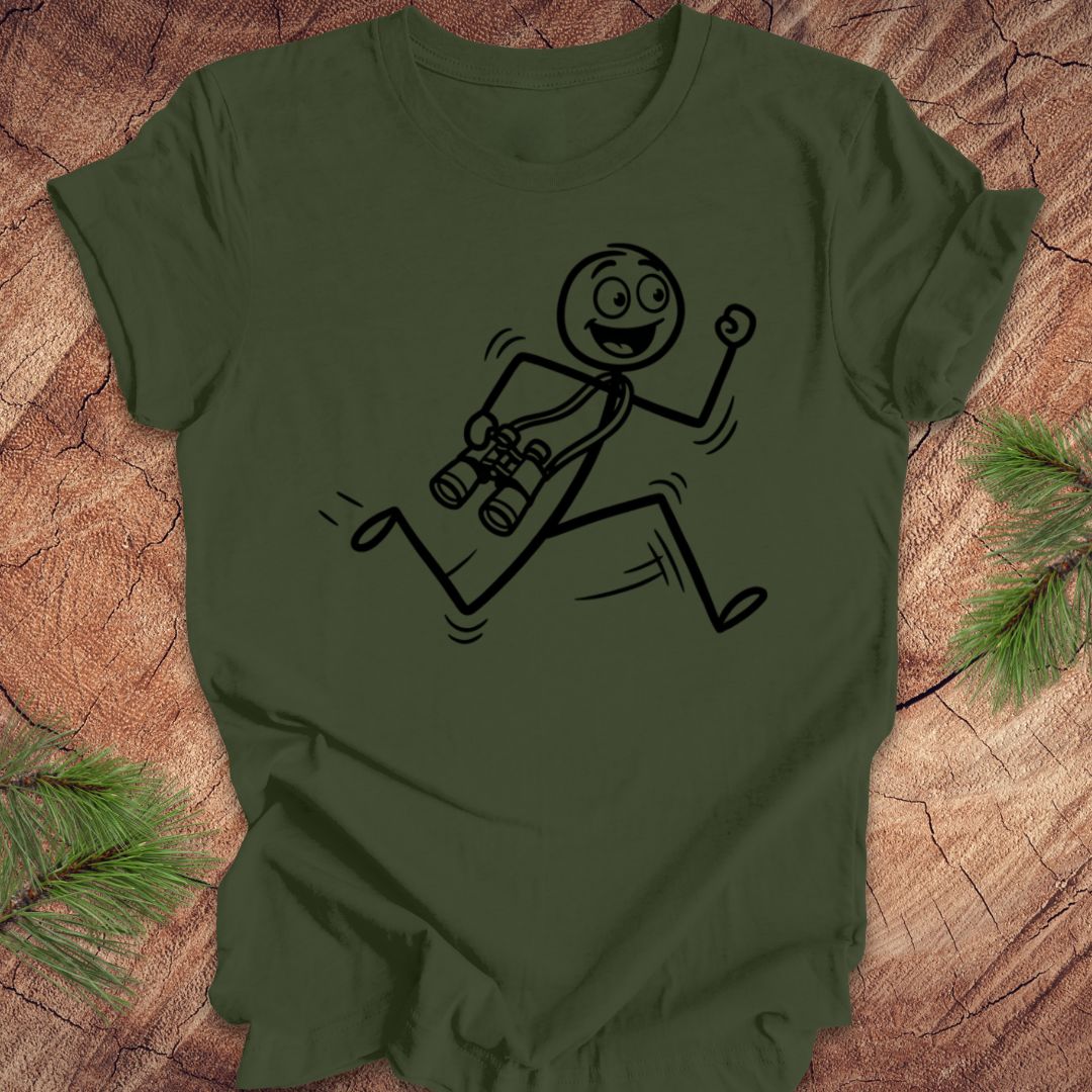 Green t-shirt with a stick figure design running with binoculars on a wooden surface