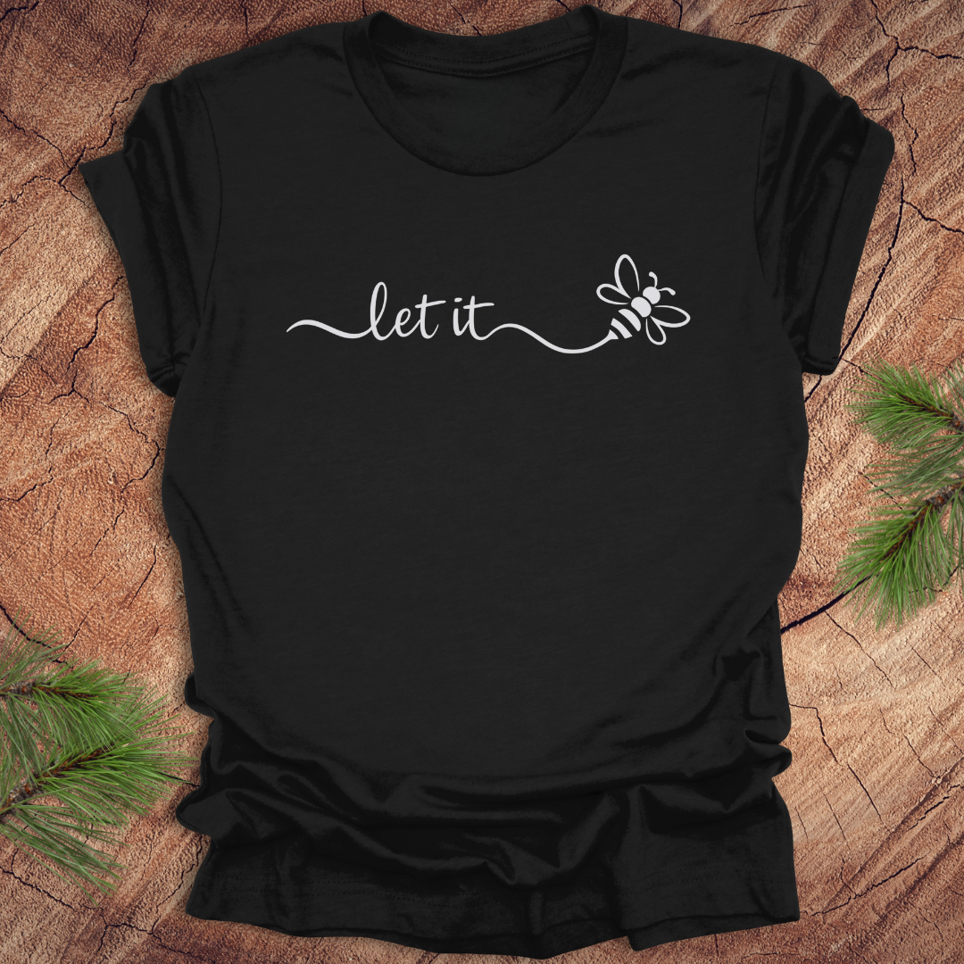 Black t-shirt with 'let it bee' and bee design on a wooden surface