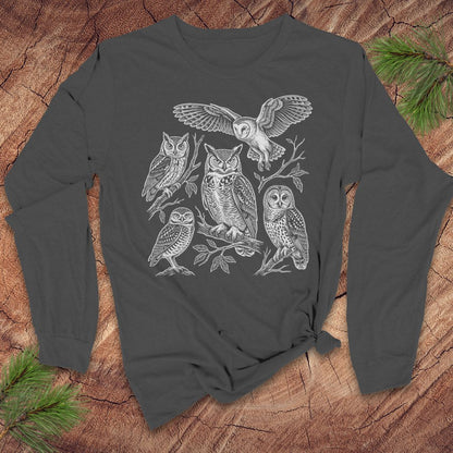 Gray long-sleeve tshirt with white owl design on a wooden surface