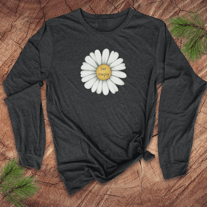 Dark gray long-sleeve shirt with a white flower graphic and 'live simply' text on a wooden surface.