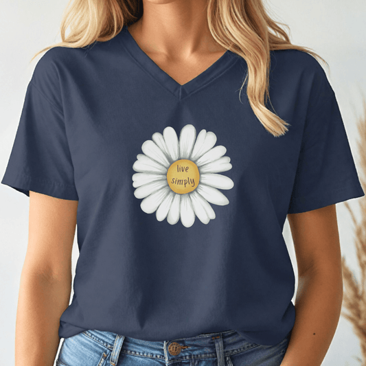 Navy blue v-neck t-shirt with a white daisy graphic and 'live simply' text on a plain background
