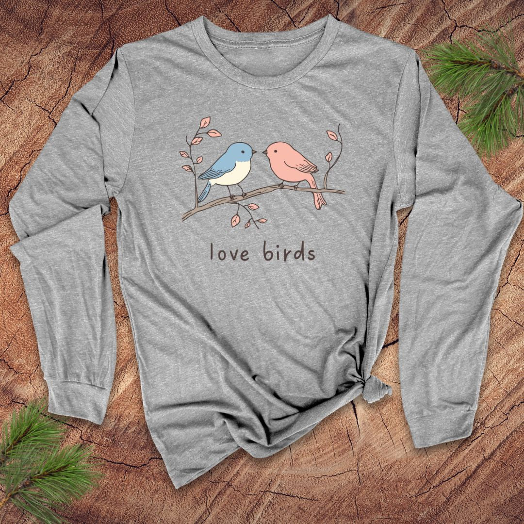 Gray long-sleeve shirt with 'love birds' design on a wooden surface