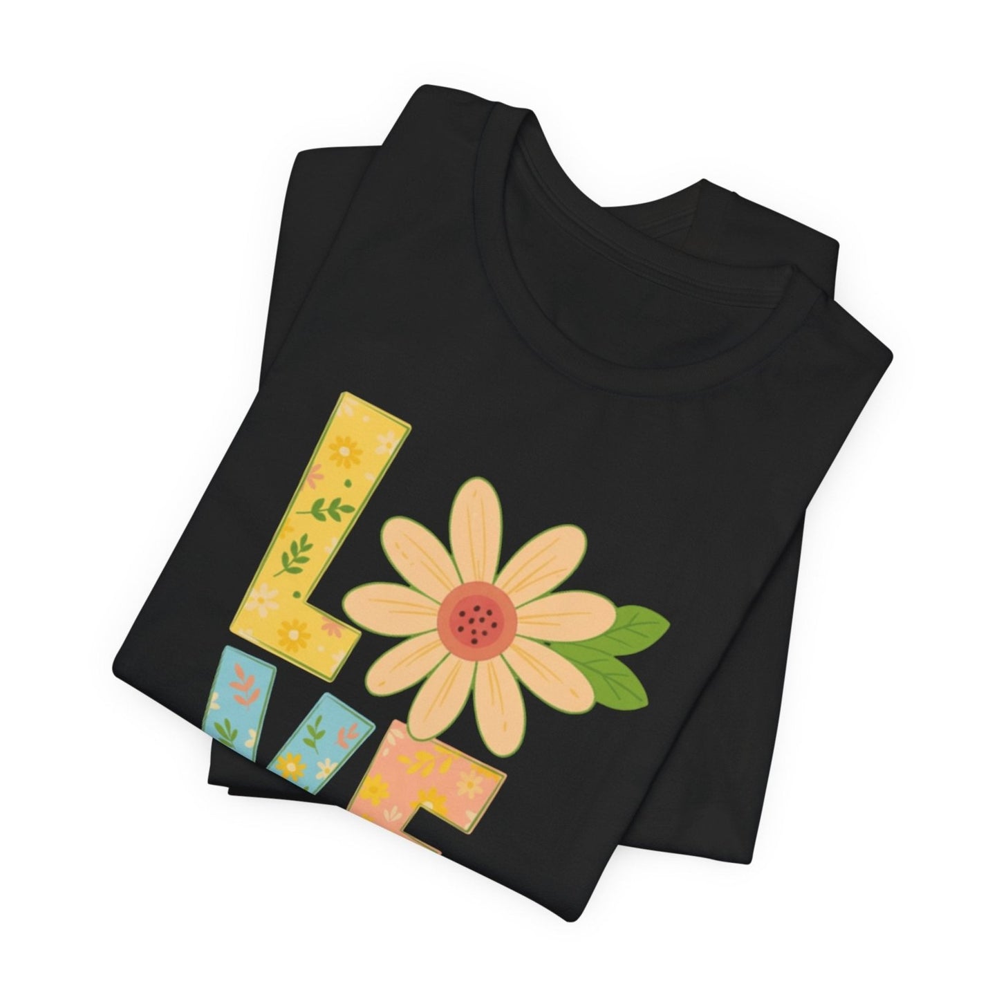 Black folded t-shirt with a colorful 'L' and flower design on a white background