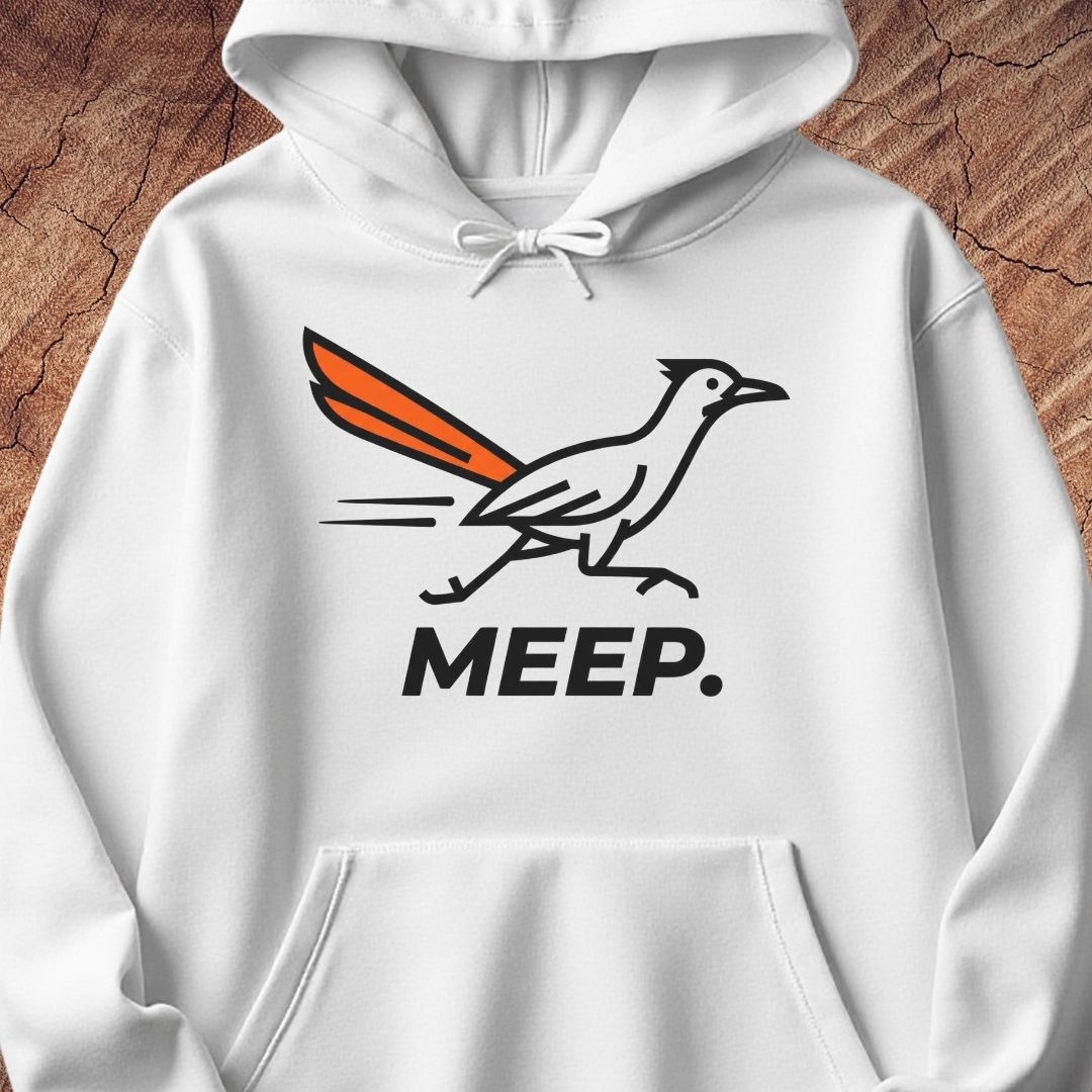 A white pullover hoodie featuring a graphic of a roadrunner with an orange tail and the word 'MEEP.' printed below in black, displayed against a rustic wood background.