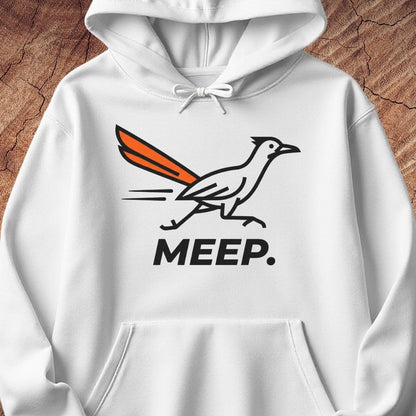 A white pullover hoodie featuring a graphic of a roadrunner with an orange tail and the word 'MEEP.' printed below in black, displayed against a rustic wood background.