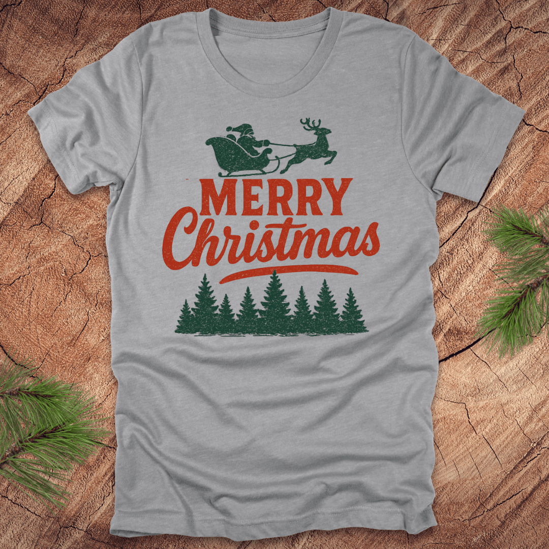 Gray t-shirt with 'Merry Christmas' design featuring Santa and reindeer on a wooden surface.