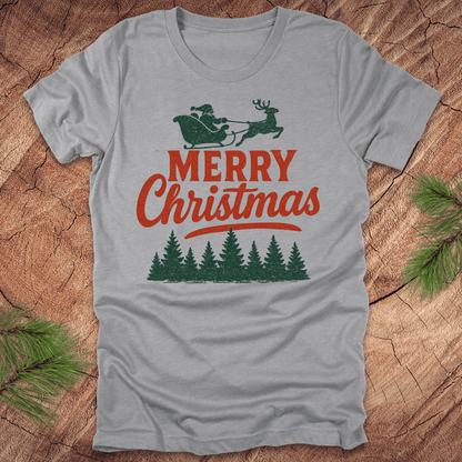 Gray t-shirt with 'Merry Christmas' design featuring Santa and reindeer on a wooden surface.