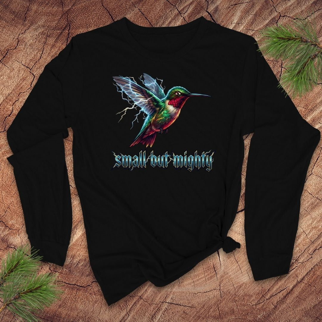 Black long-sleeve shirt with a lightning hummingbird design and 'small but mighty' text on a wooden surface.