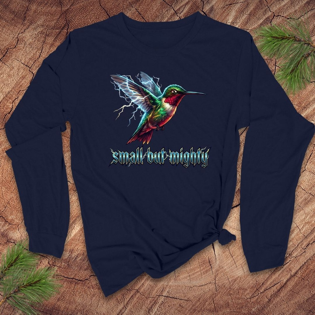 Navy blue long-sleeve shirt with a lightning hummingbird design and 'small but mighty' text on a wooden surface.