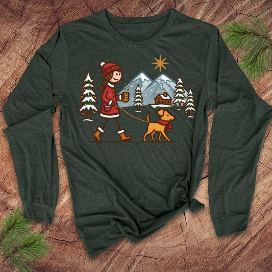Green long-sleeve shirt with a winter scene design featuring a person and dog on a leash.
