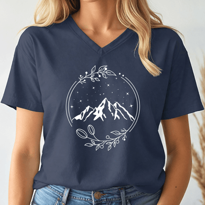 Navy blue t-shirt with mountain design worn by a person on a white background