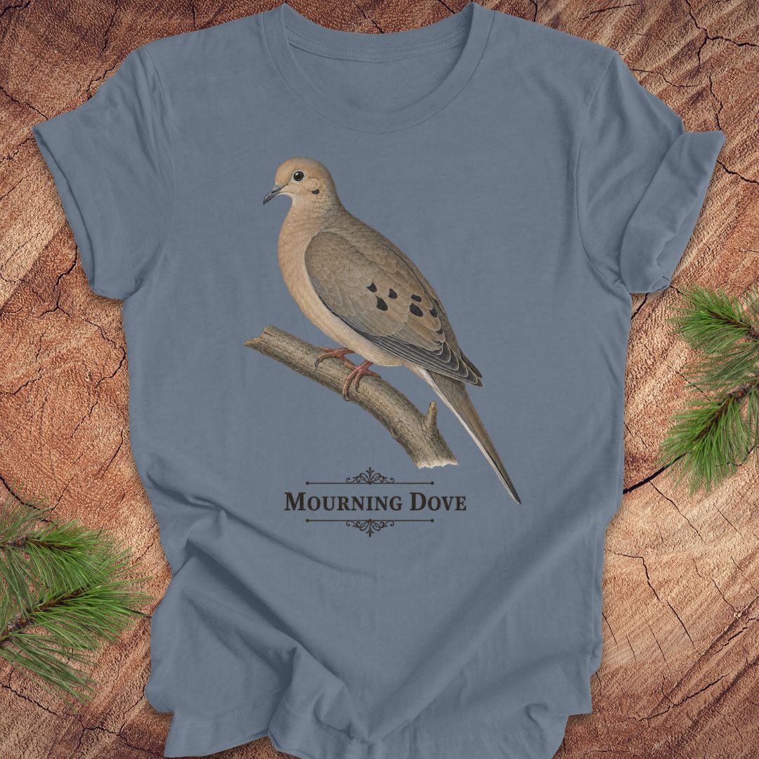 Blue t-shirt with a mourning dove bird and text on a wood background.