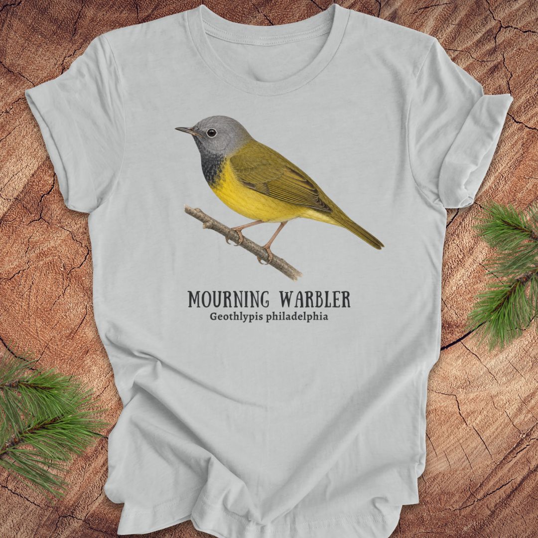 Gray t-shirt with a mourning warbler illustration and text on a wooden surface