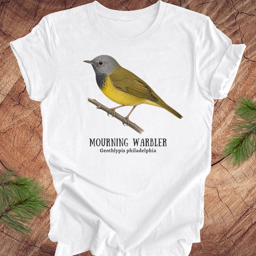 White t-shirt with a mourning warbler illustration and text on a wooden surface