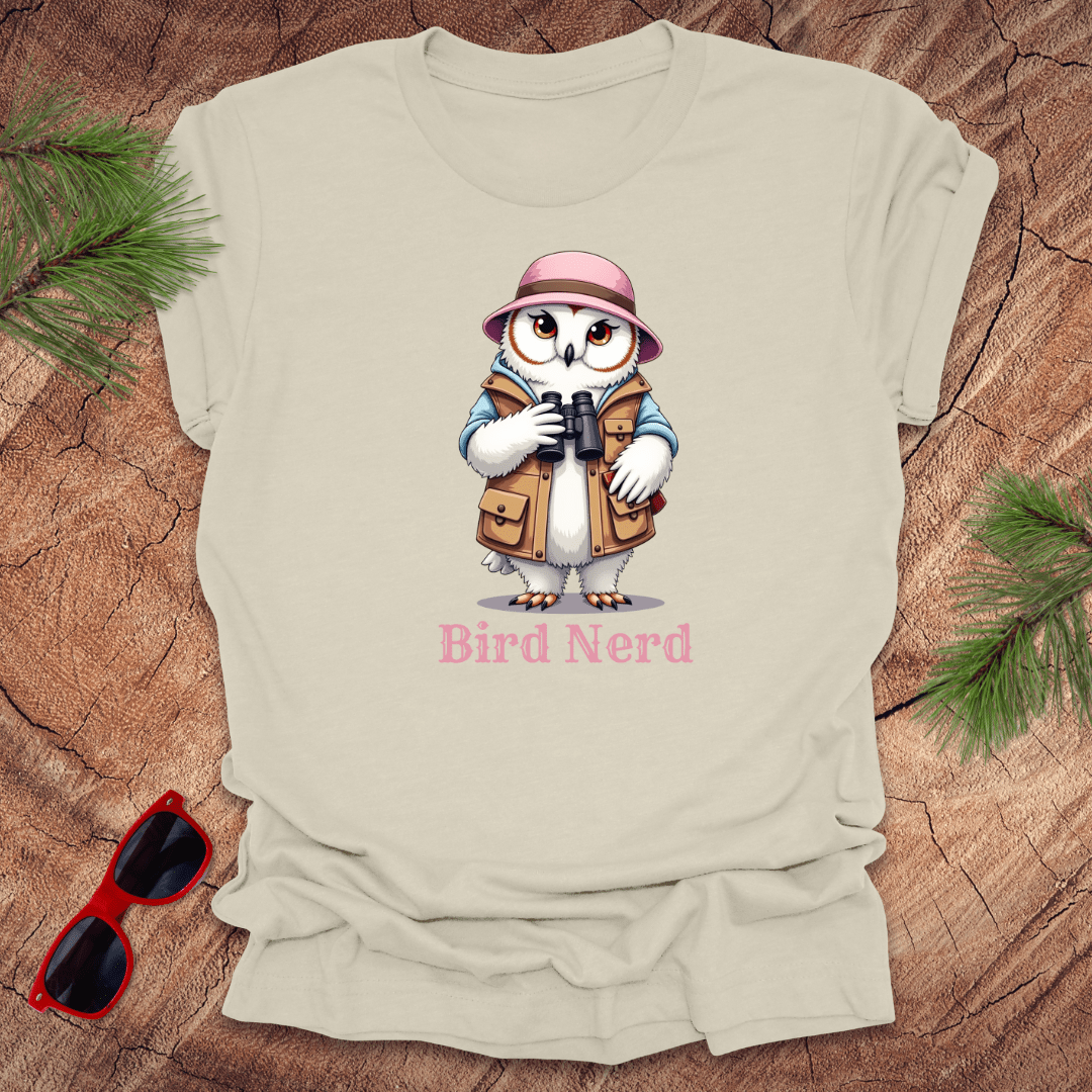 Beige snowy owl in birdwatching gear with "bird nerd" text on a wood background.
