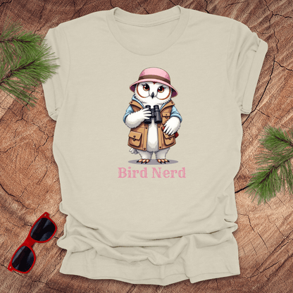 Beige snowy owl in birdwatching gear with "bird nerd" text on a wood background.