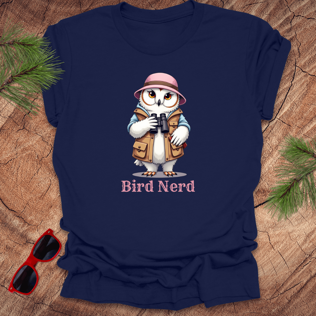 Navy blue t-shirt with an animated snowy owl in birdwatching gear with "bird nerd" text on a wood background.