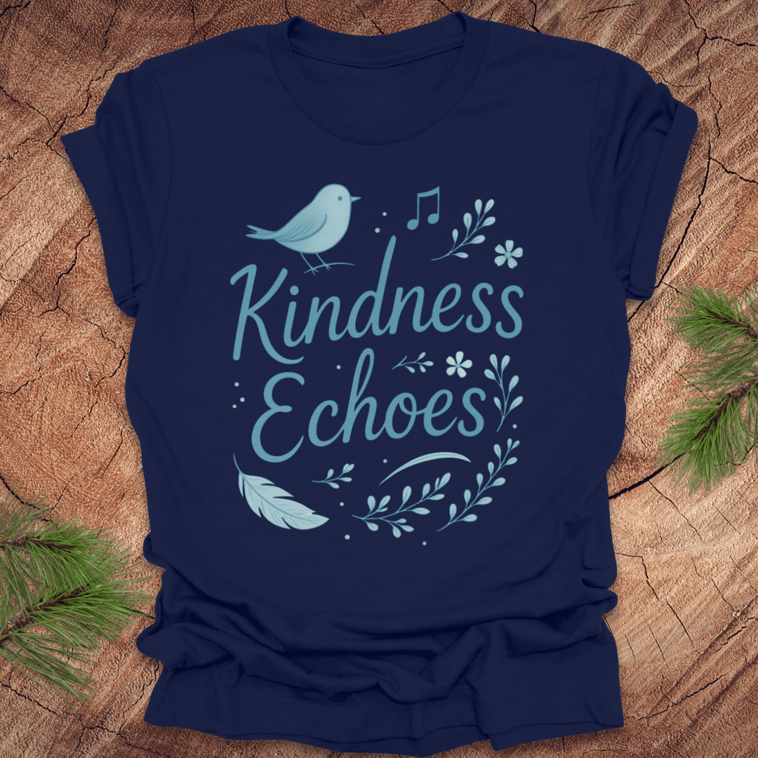 Navy blue t-shirt with birds and flowers and text, 'Kindness Echoes' design on a wooden surface.