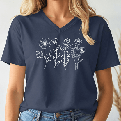 Navy blue v-neck t-shirt with white floral designs worn by a person