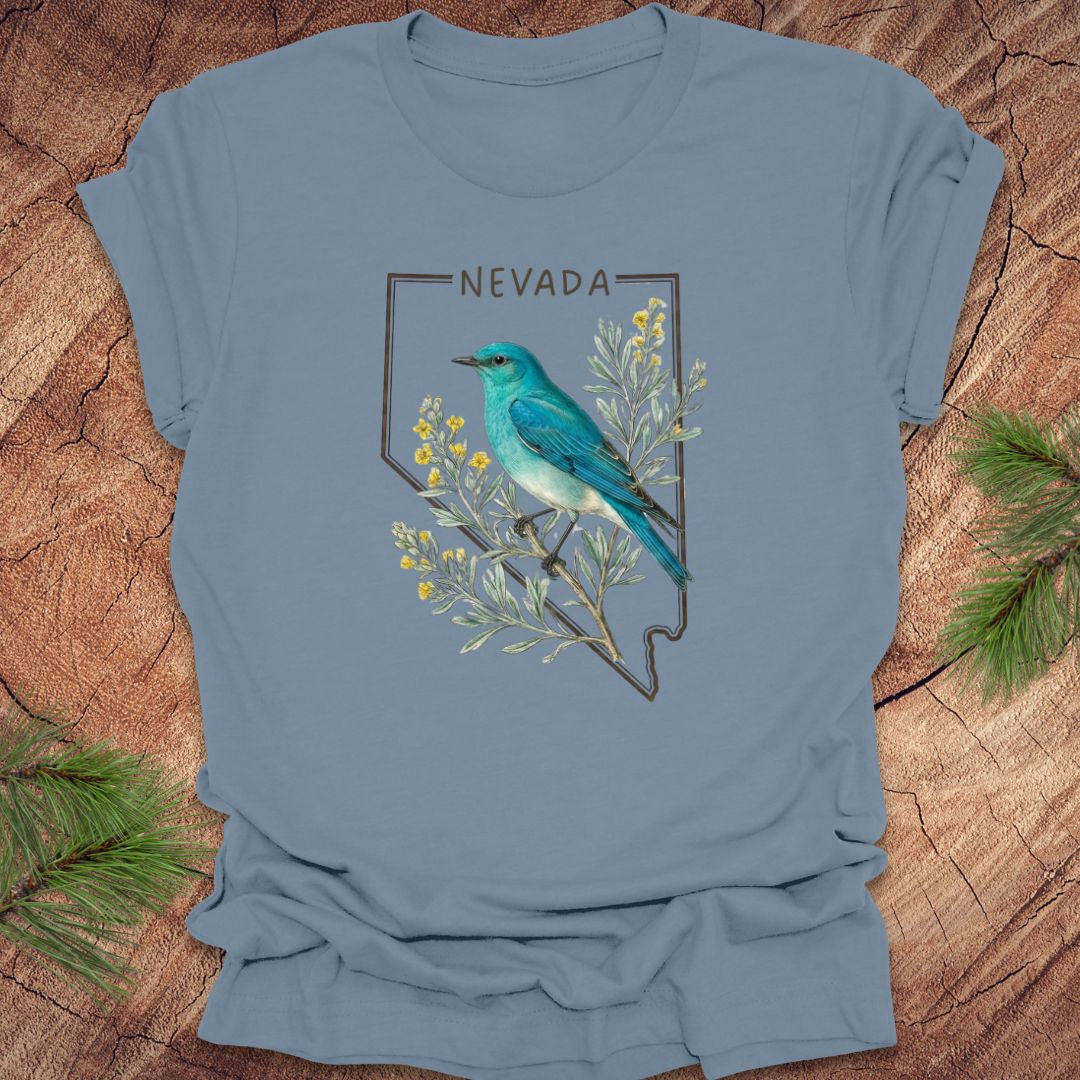 Steel blue t-shirt with Nevada state design featuring a mountain bluebird and sagebrush on a wooden surface.
