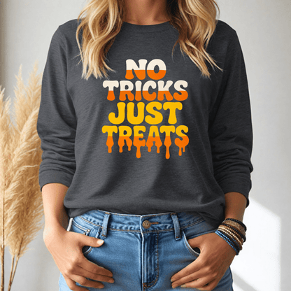 Person wearing a dark gray long sleeve tshirt with 'No Tricks Just Treats' text, standing against a neutral background.