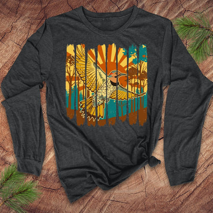 Gray long-sleeve shirt with a colorful northern flicker bird and sunrise design on a wooden surface