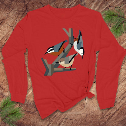 Red long-sleeve shirt with nuthatch bird design on a wooden surface
