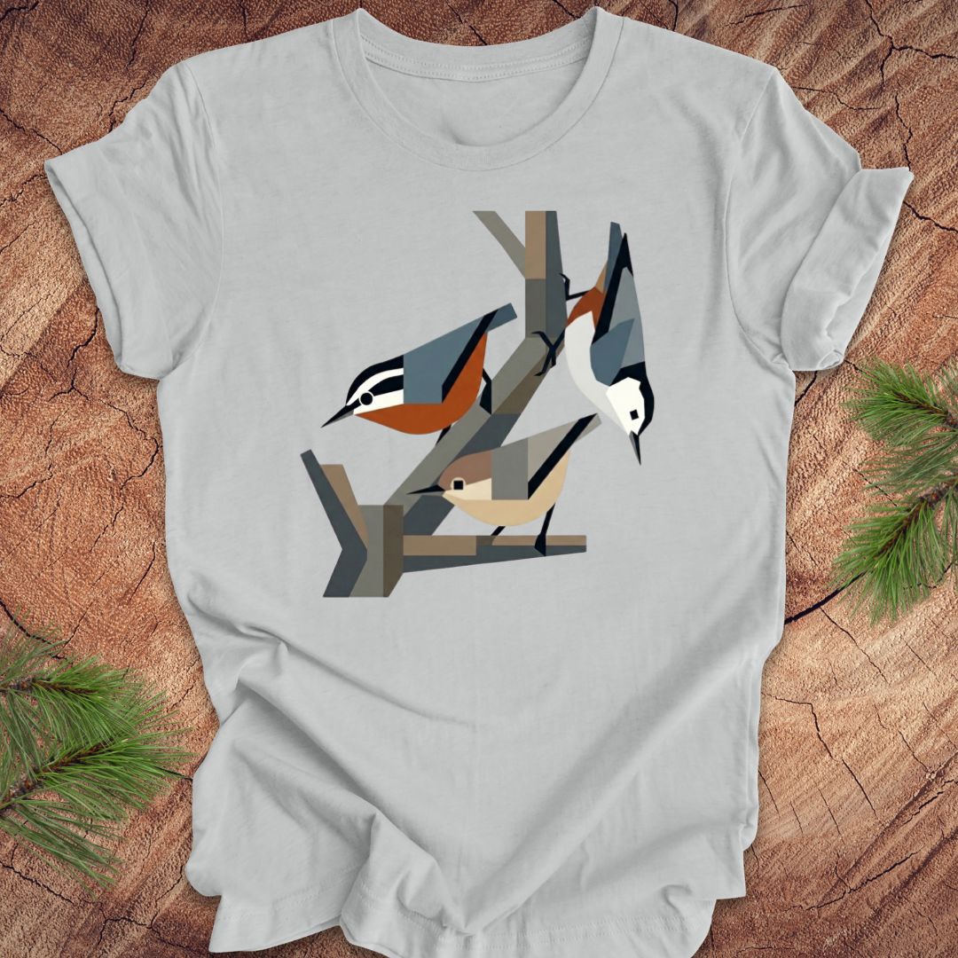 Gray t-shirt with nuthatch design on a wooden surface
